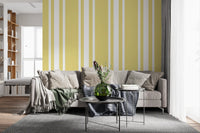 Soft yellow pattern wallpaper with narrow white breaks and ticking detail