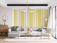 Living room wall featuring Ticking Stripe Wallpaper in farmhouse yellow tones