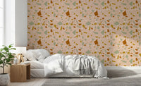 Decorative wallpaper blending cream terrazzo pieces with warm peach colour