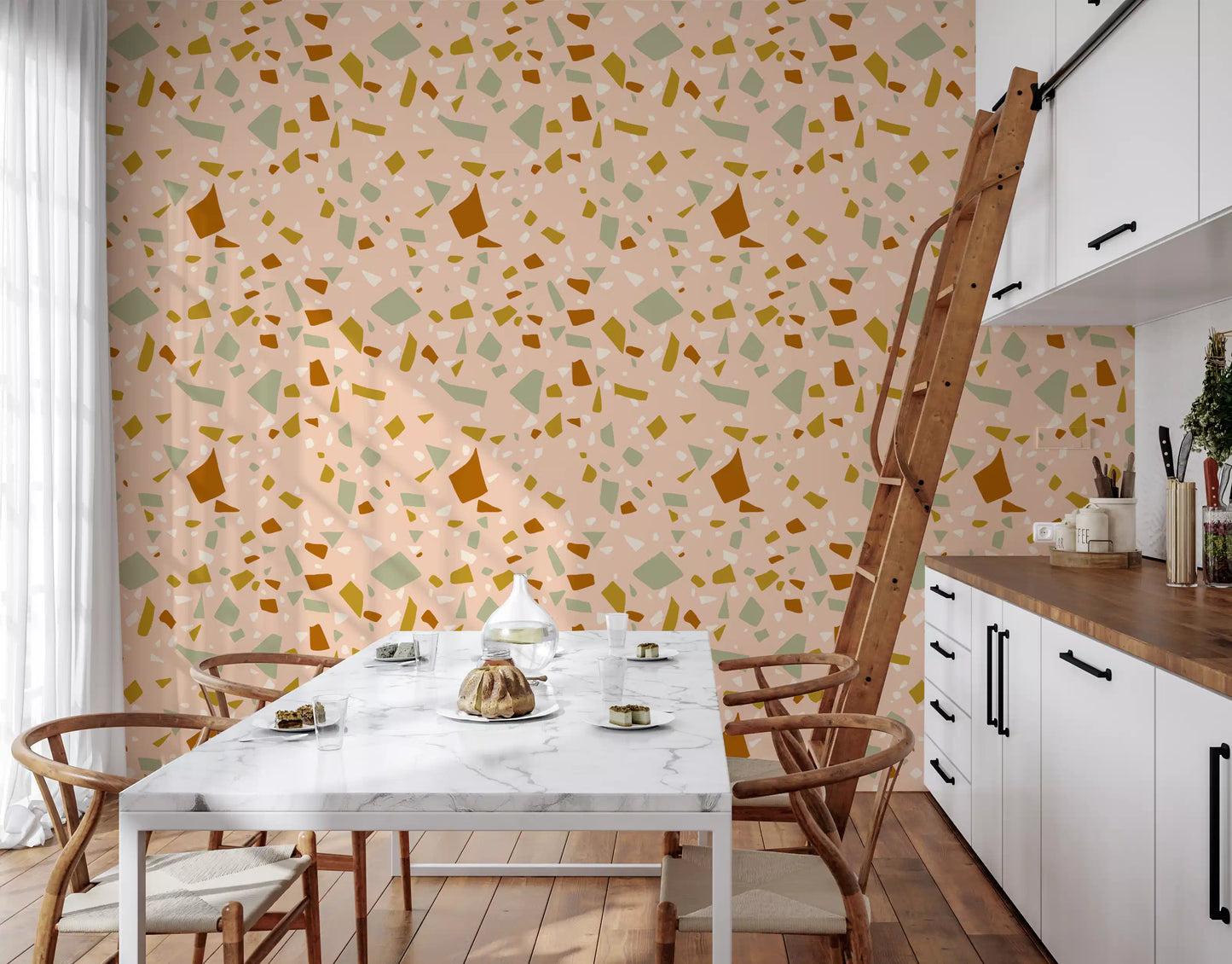Kitchen area surface styled with Peach Sage terrazzo-inspired wallpaper