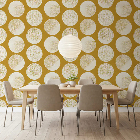 Dining room with cream mustard wallpaper and oversized stippled circles