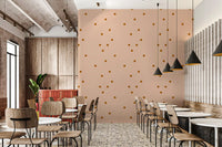Cafe area wall featuring retro minimal wallpaper in a pale peach-beige tone