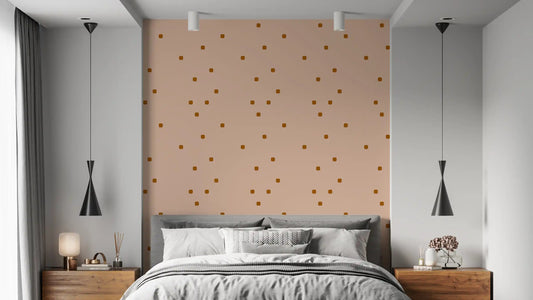 Bedroom wall showing blush beige wallpaper with soft rounded dot marks