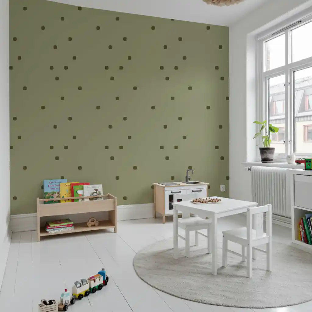 Play area wall showing sage green wallpaper with soft polka dot styling