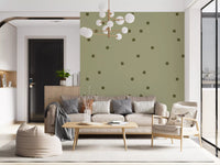 Living room using polka dot wallpaper in a soft sage retro layout