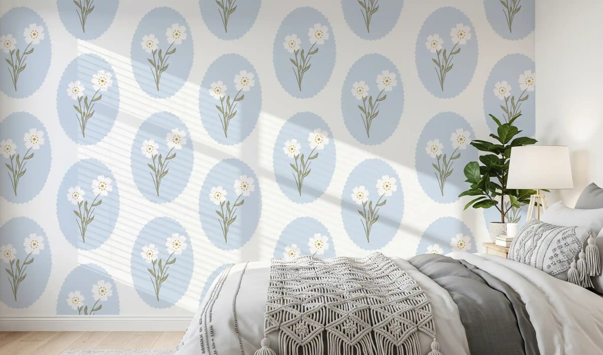 Pale blue ovals and tiny white blooms behind a bedroom headboard wallpaper