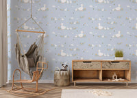 Hallway nook framed by Baby Ducklings wallpaper beside a tall mirror and console
