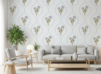 Cornflower trellis wallpaper behind a low sofa in a soft-toned living room