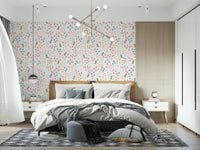 Plus-mark accents pepper the ivory ground of the doodle Flower wallpaper 