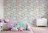 Illustrated unicorns on a blue check grid for Unicorn wallpaper