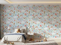 Cosy nursery styled with Checkerboard Unicorn wallpaper and plush toys