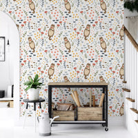 Whimsical Otters Wildflowers wallpaper showing brown otters holding pink bloom