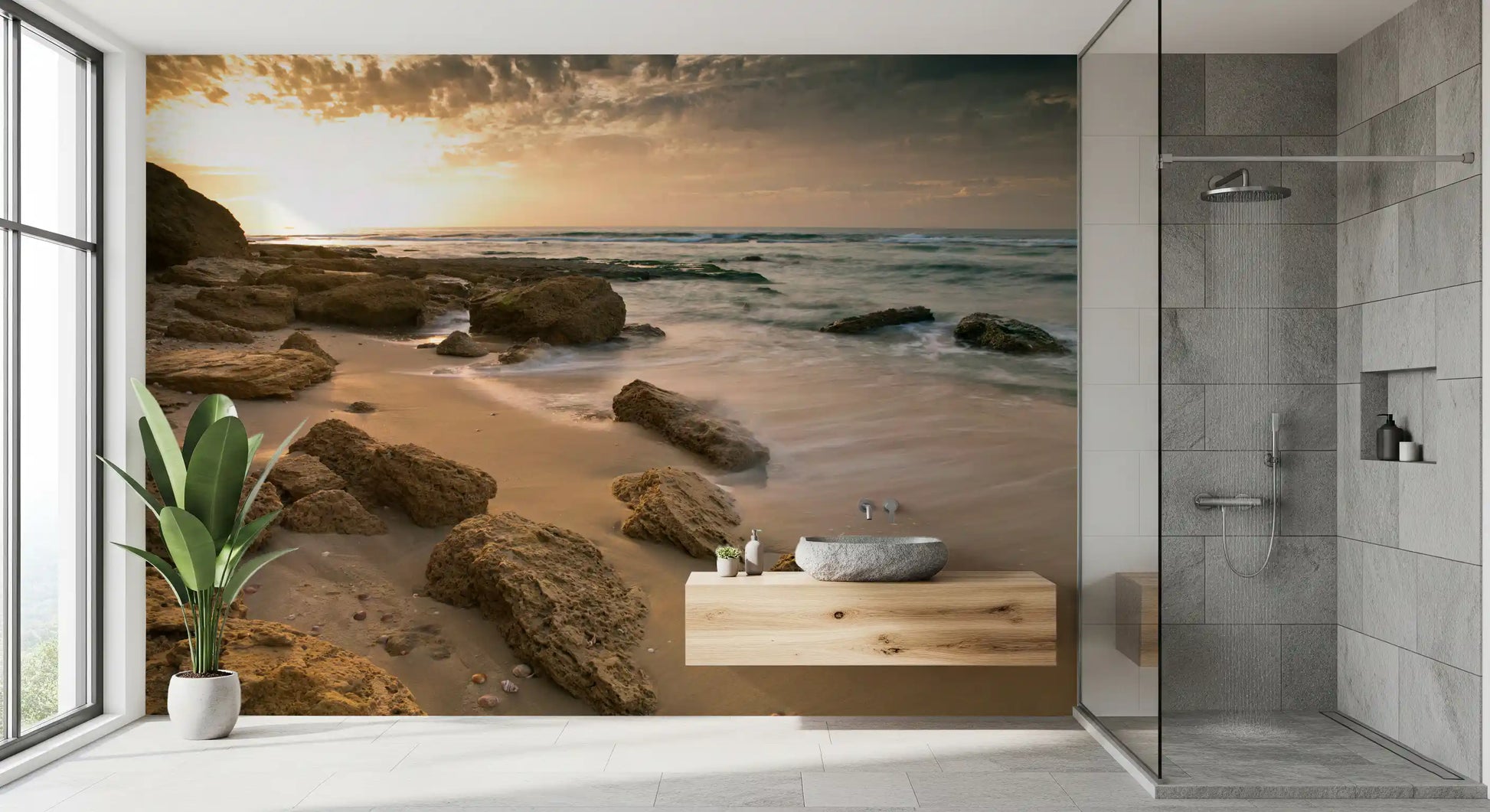 Calm surf rolls past worn stones in the Golden Shore wall mural