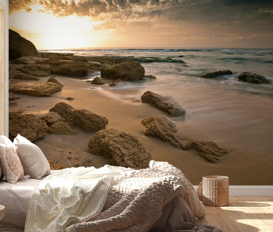 Bedroom framed by the rocky beach Golden Quiet Shore wall mural
