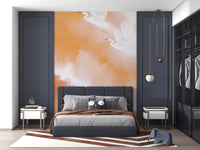 Coral and gold sky framing the Ethereal Flight wall mural herons