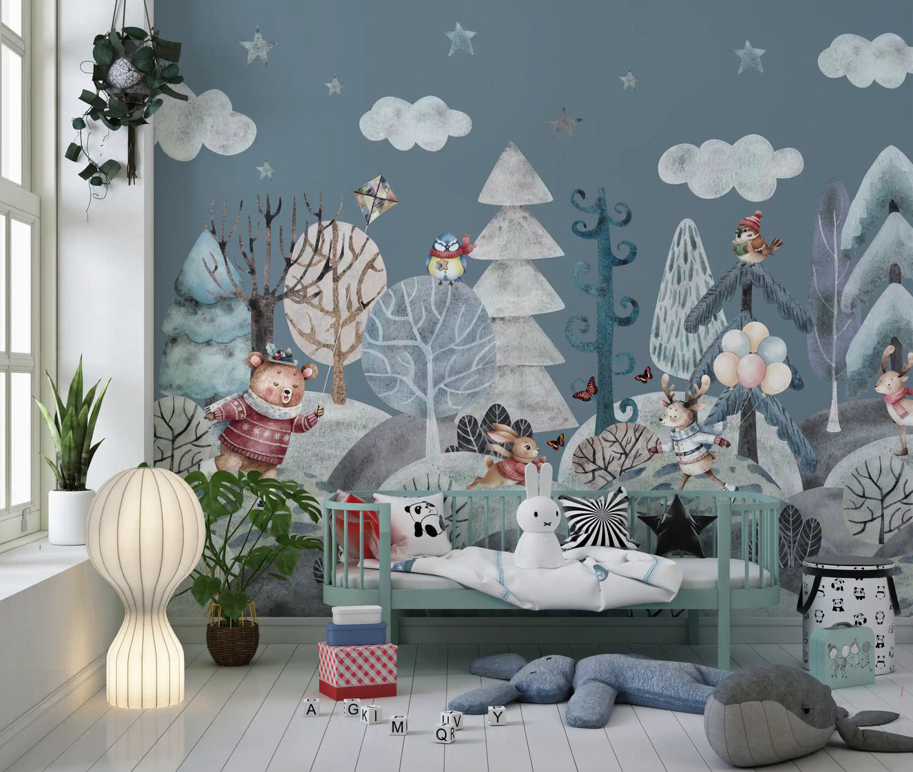 Frolicking Forest Friends wall mural fills a Nursery with a dusky teal winter scene.
