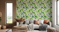 White hibiscus blooms layer the living room in this Hawaiian Aloha wallpaper