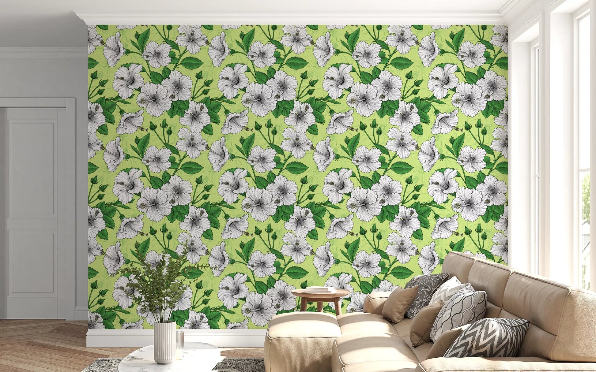 Lime green and white fill a quiet lounge with hibiscus wallpaper detail.