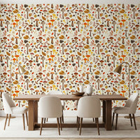 Toadstools and oak leaves drift around mushroom wallpaper in a dining room.
