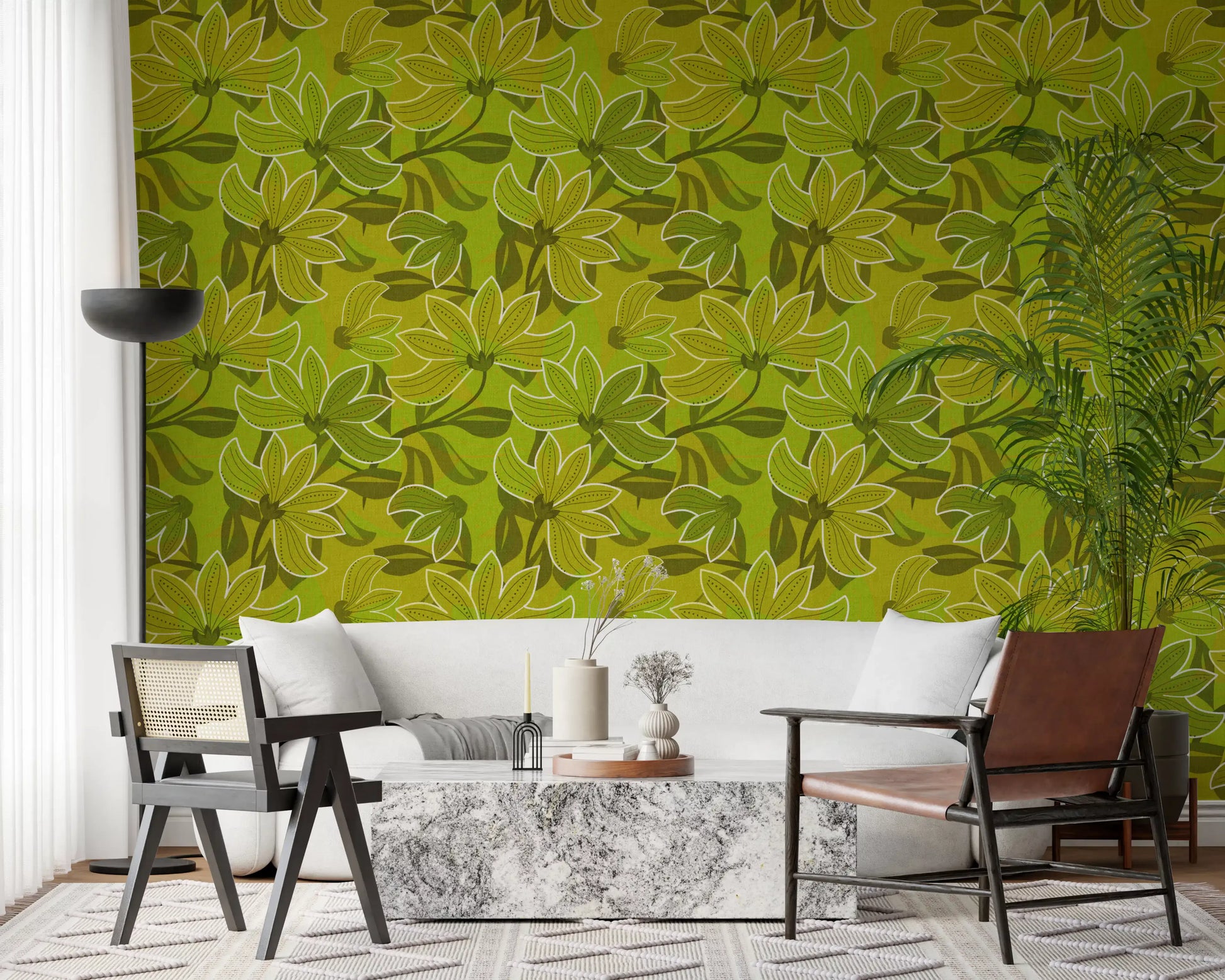 Lounge corner styled around the Green Bloom wallpaper near a cane sofa