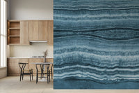 Dark navy pockets weave between teal strata in the wall mural close detail
