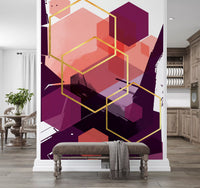 Overlapping hexagons in coral and plum across the Bold Flow wall mural