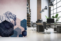 Navy bare branch trees rise across blush sky inside the Geometric Grove wall mural.