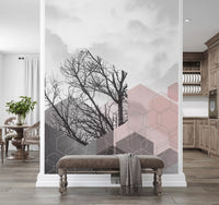 Pale clouds frame bare branches in this geometric hexagon wall mural