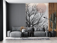 Two perched birds rest inside the rose-toned moon of this wall mural