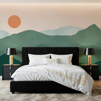 Warm orange sun glowing above sage ridges in the Green Peak Sunset wall mural