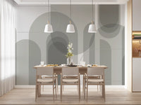 Dining area wall mural showing grey arch shapes with calm abstract styling
