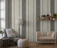 Open Nursery area carrying the striped linen wallpaper across a single span