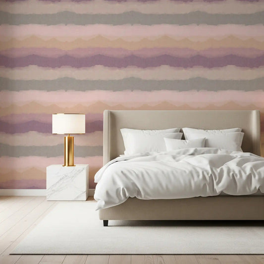Mauve and peach horizons fill a bedroom in the Sunrise Painted Horizon wallpaper.