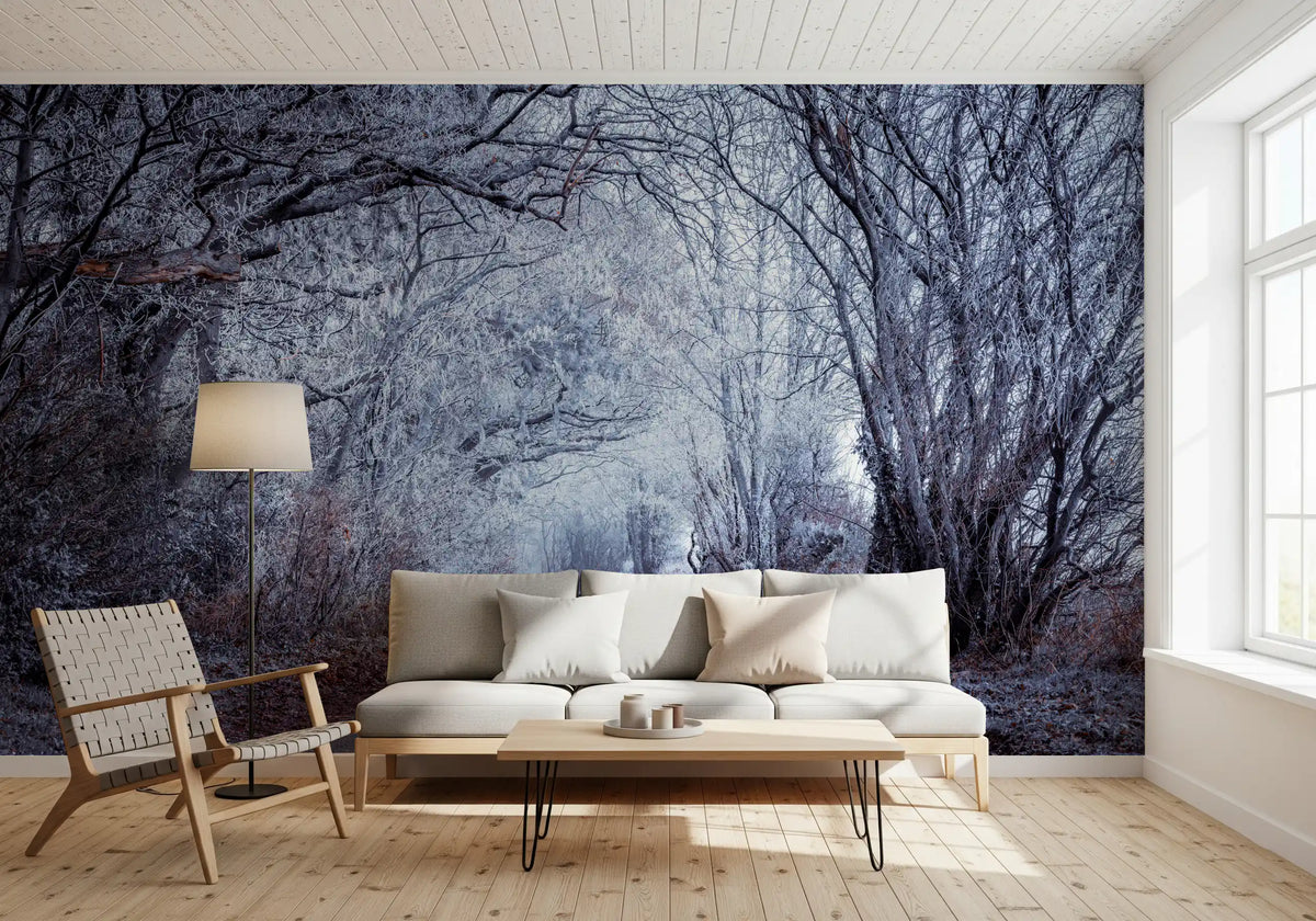 Frosted trees curving overhead complete a calm living room with this wall mural.