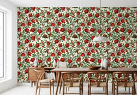 Painterly clusters of red fruit and moths sit across the Pomegranate Orchard wallpaper.