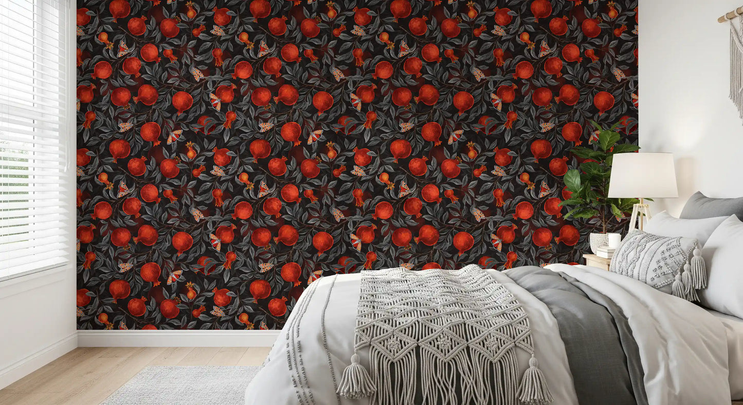 Crimson fruit and inky foliage frame the bedroom through this pomegranate wallpaper.
