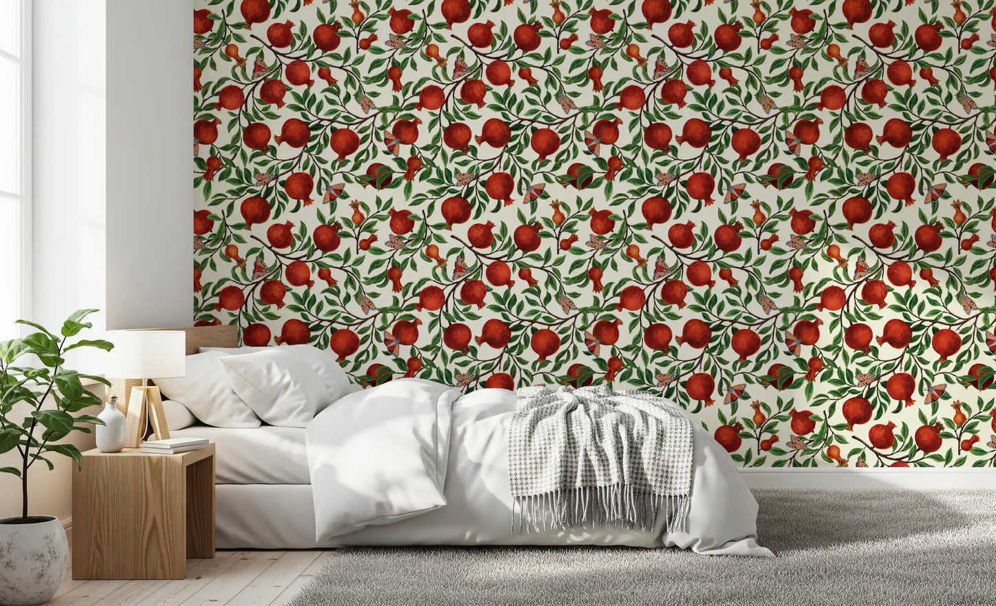 A Bedroom gains a botanical look with this pomegranate and moth wallpaper.