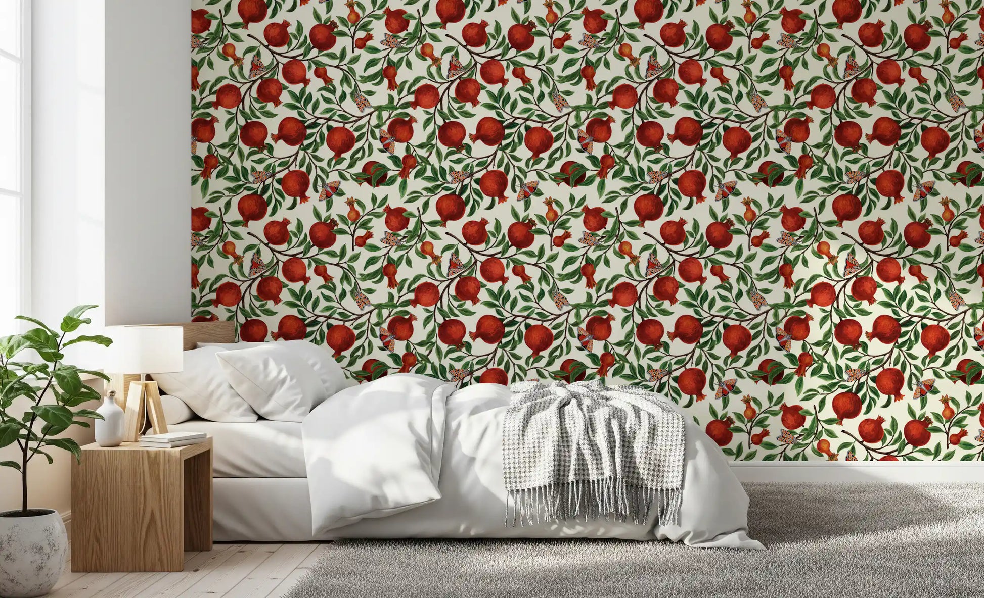 A Bedroom gains a botanical look with this pomegranate and moth wallpaper.
