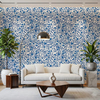 Cool blue blooms drift through Living room in the Wild Roses Blue and White wallpaper.