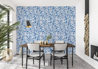 In a Dining area, the Wild Roses Blue and White wallpaper holds a steady cool repeat.