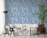 Living room takes a calm floral surface from the Blue and White Roses wallpaper.