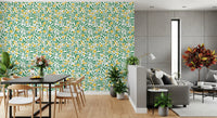 Curling green vines wrap around yellow flowers across this Golden Bloom Rose Wallpaper.