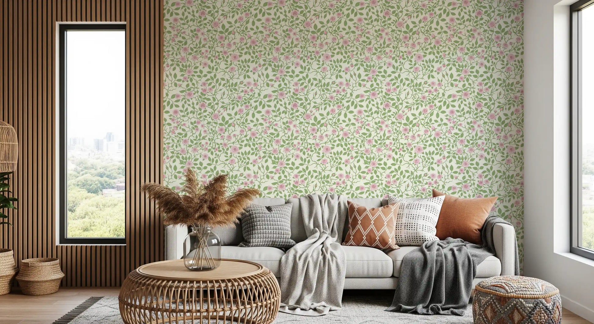 Cream ground holds pale roses, green leaves, and thorny stems in this briar wallpaper.