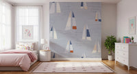 Tidy rows of boats stretch along the Kids room with Mid Century Sailboats wall mural.