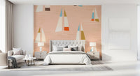 Tan and rust hulls float over a peach sea on the Mid Century Sailboats wall mural.
