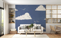 Dining room styled with a cloud and bird wall mural in dusty blue