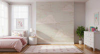 Plump cloud shapes nod to retro on the Mid Century Sky Cream wall mural.