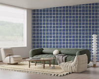 A Living room stays calm with blue squares across this Mid Century pattern wallpaper.