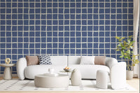 The Mid Century Wavy Grid wallpaper finishes a Living room kept in muted, quiet tones.