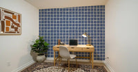 Wavy grid lines in dusty blue fill a Study room with a casual mood, all in one wallpaper.